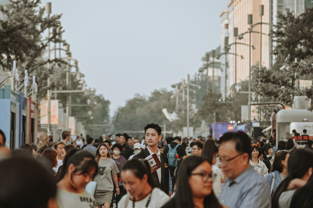 diverse people in city queue